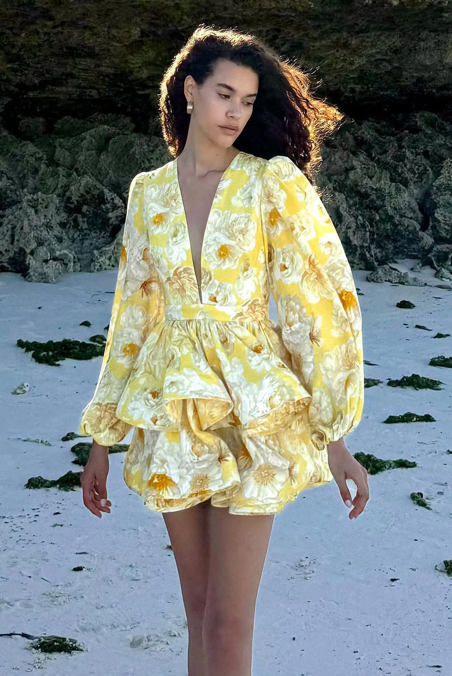 Yellow Lyra floral mini dress with deep V-neck from Lumina Vancouver, featuring a fitted silhouette and sleeveless design.