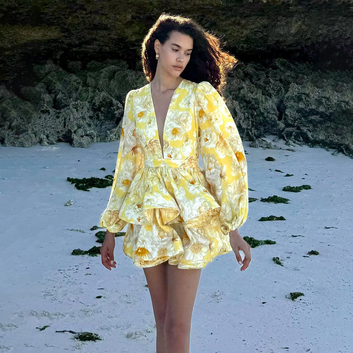 Yellow Lyra floral mini dress with deep V-neck from Lumina Vancouver, featuring a fitted silhouette and sleeveless design.