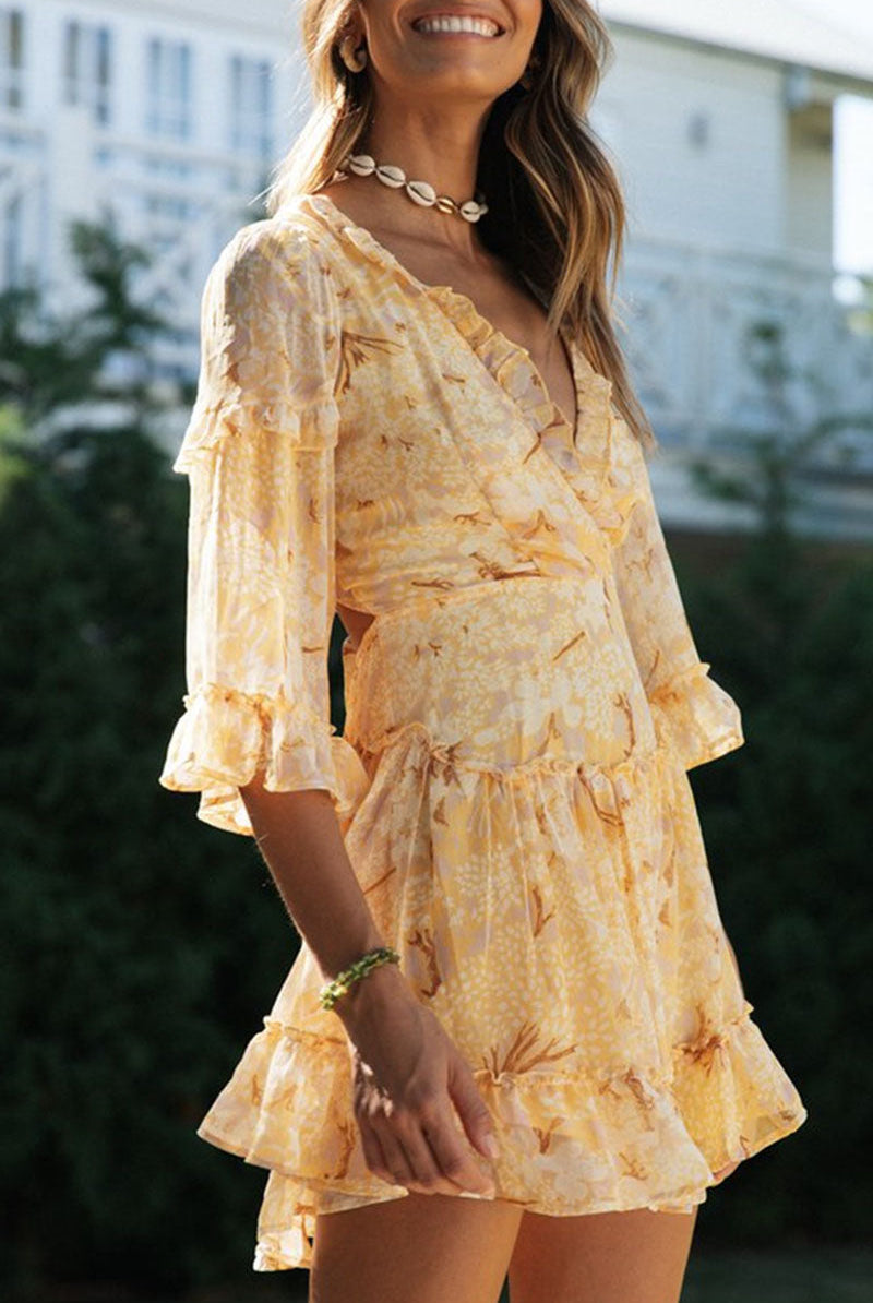 Suzette V-neck floral print mini dress by Lumina Wear, white with colorful floral pattern, sleeveless design.