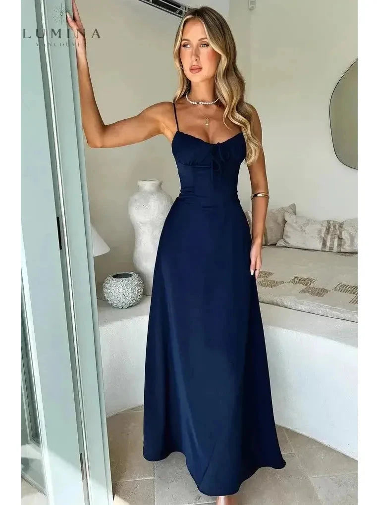 Yellow Maelys lace-up sleeveless maxi dress by Lumina Vancouver, perfect for wedding guests, featuring a flowing silhouette.