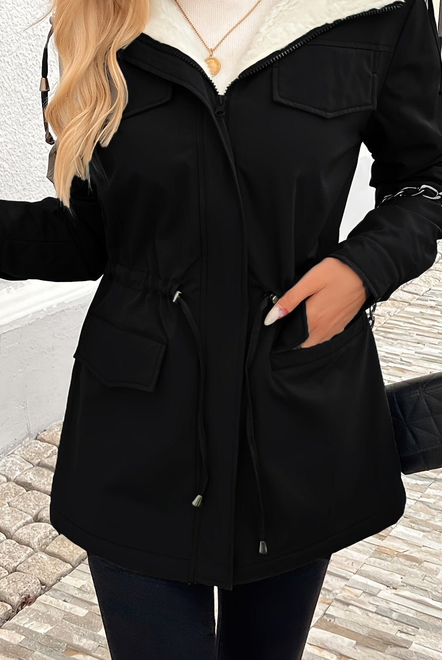 Maisie Lumina Wear cozy black sherpa-lined parka jacket with adjustable fit, warm and stylish for cold weather.