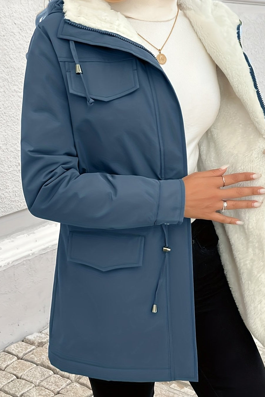 Black Maisie Sherpa-lined parka jacket by Lumina Wear with adjustable fit, cozy interior, and stylish design for cold weather.