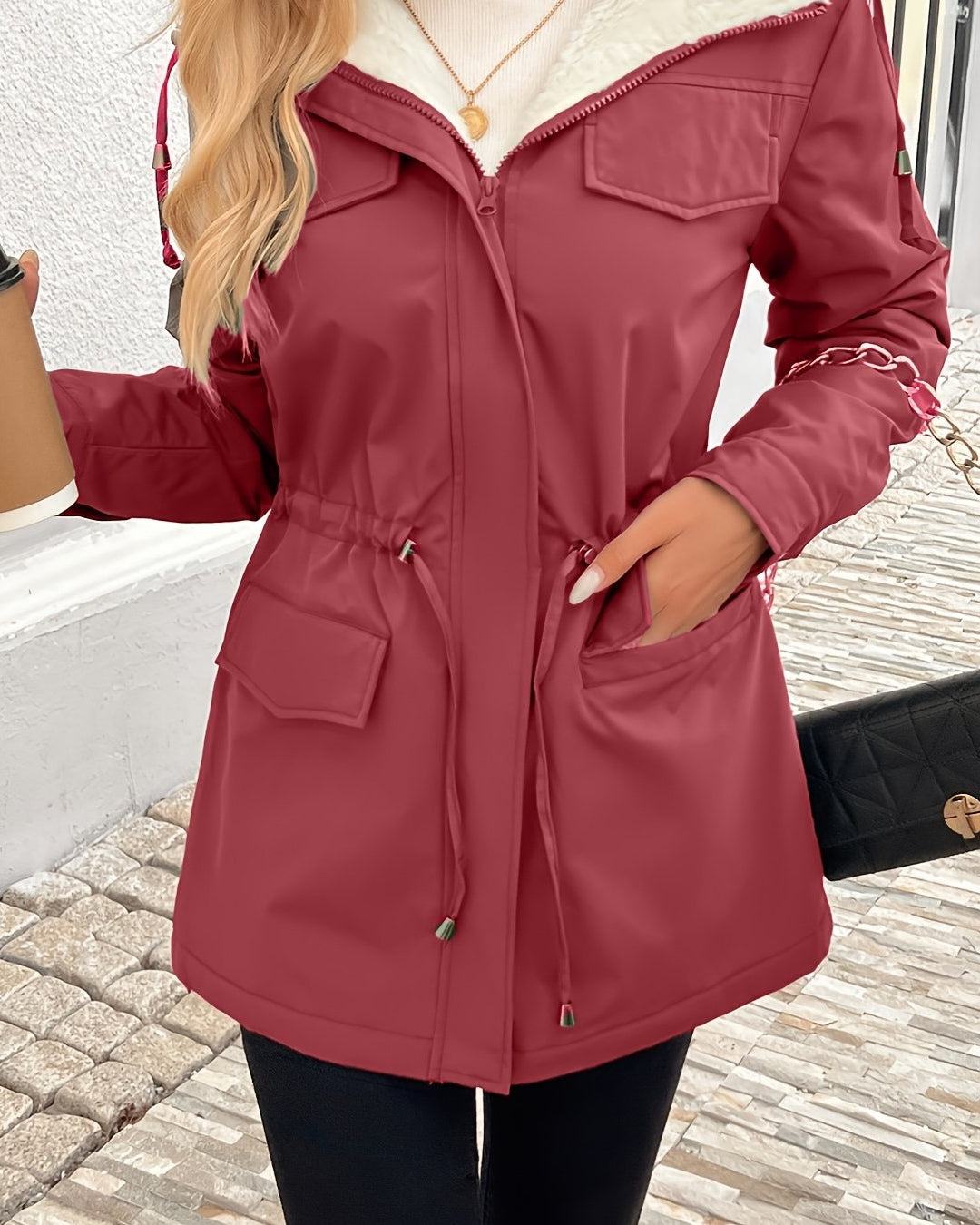 Black Sherpa-lined parka jacket with adjustable fit from Lumina Wear, featuring cozy interior and stylish design.