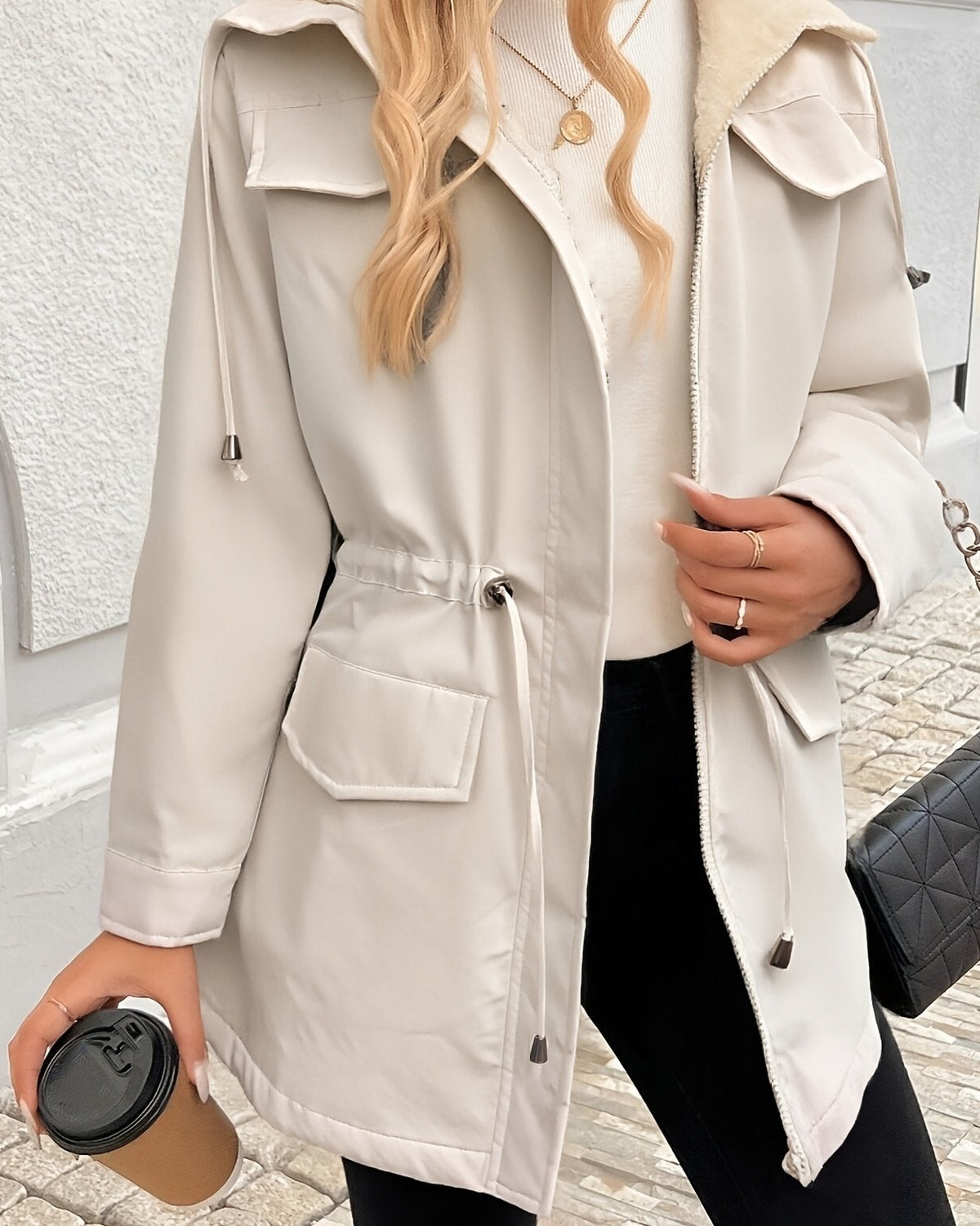Maisie cozy Sherpa-lined Lumina Wear parka jacket in black with adjustable fit, warm and stylish coat for cold weather.