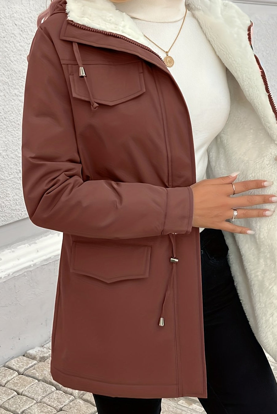 Maisie cozy Sherpa-lined parka jacket by Lumina Wear in black, featuring adjustable fit and warm, soft interior.