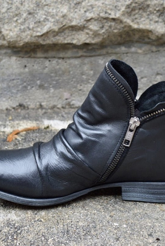 Makayla black leather ankle boots with sleek design, stylish footwear by Lumina Wear, featuring a classic silhouette and smooth finish.