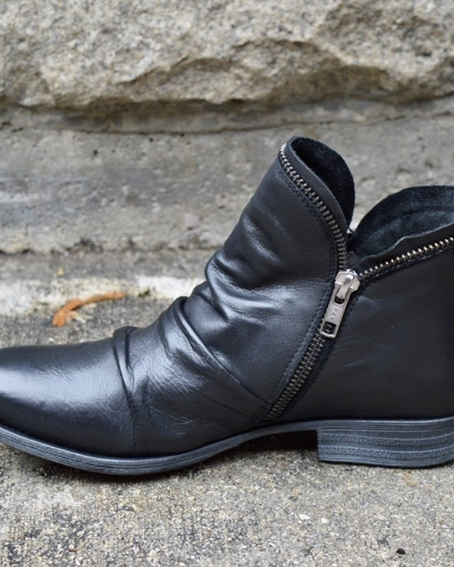 Makayla black leather ankle boots with sleek design, stylish footwear by Lumina Wear, featuring a classic silhouette and smooth finish.
