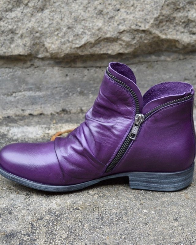 Makayla Lumina black leather ankle boots with sleek design, featuring a pointed toe and low heel for stylish comfort.