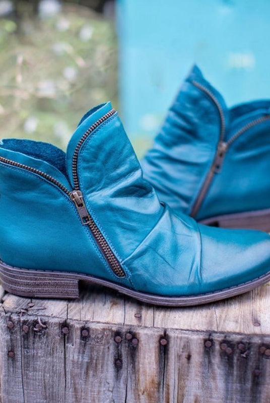 Makayla Lumina black leather ankle boots with sleek design, showcasing smooth leather and stylish silhouette.