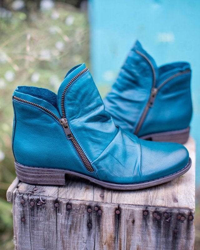 Makayla Lumina black leather ankle boots with sleek design, showcasing smooth leather and stylish silhouette.