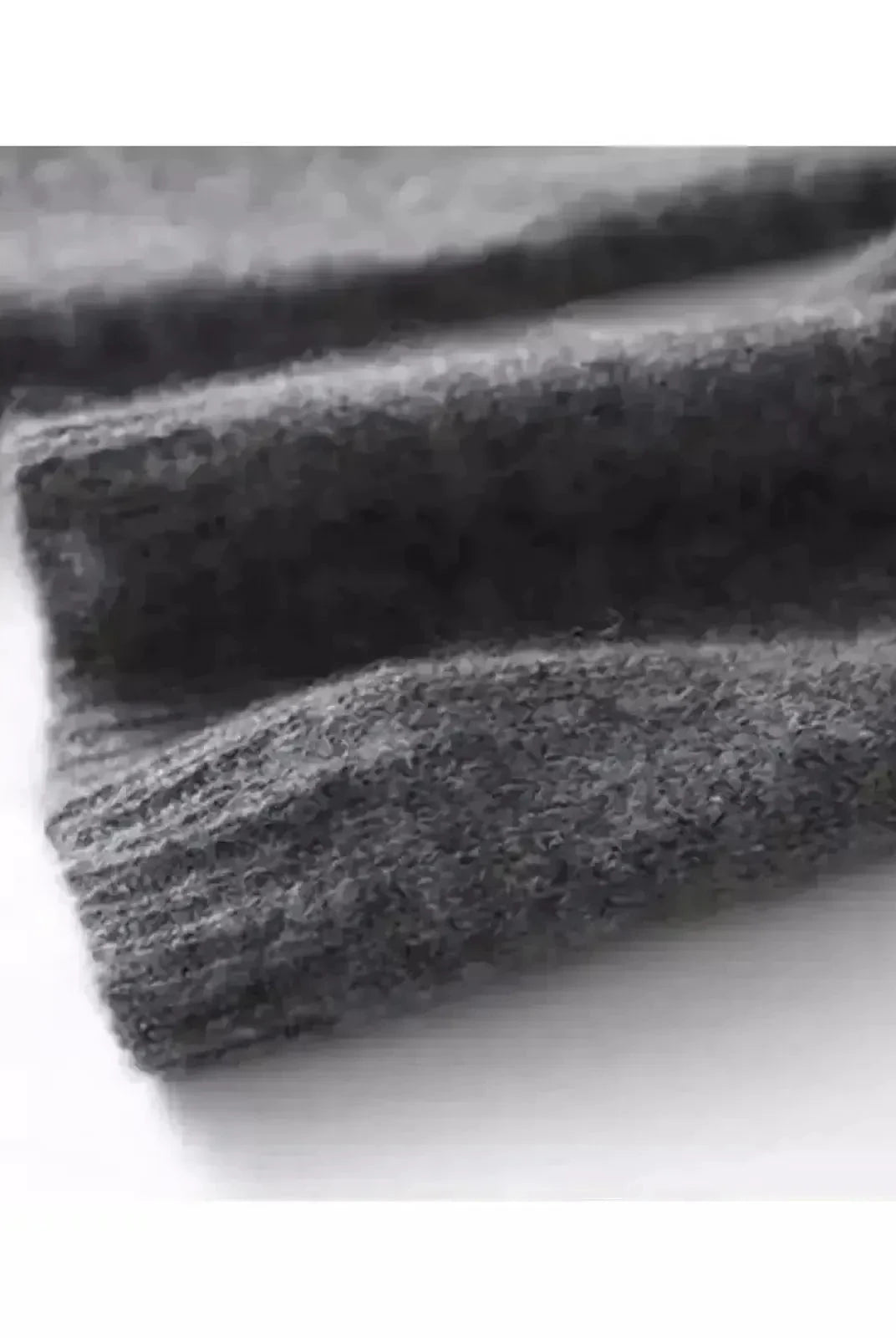 Grey Malu knitted sweater by Lumina Wear, showing a cozy, one-size-fits-all sweater with a textured knit pattern.