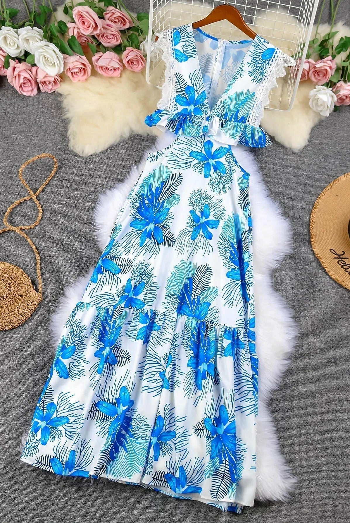 Blue sleeveless lace maxi dress by Lumina Wear featuring a trendy design and flowing silhouette, perfect for elegant occasions.
