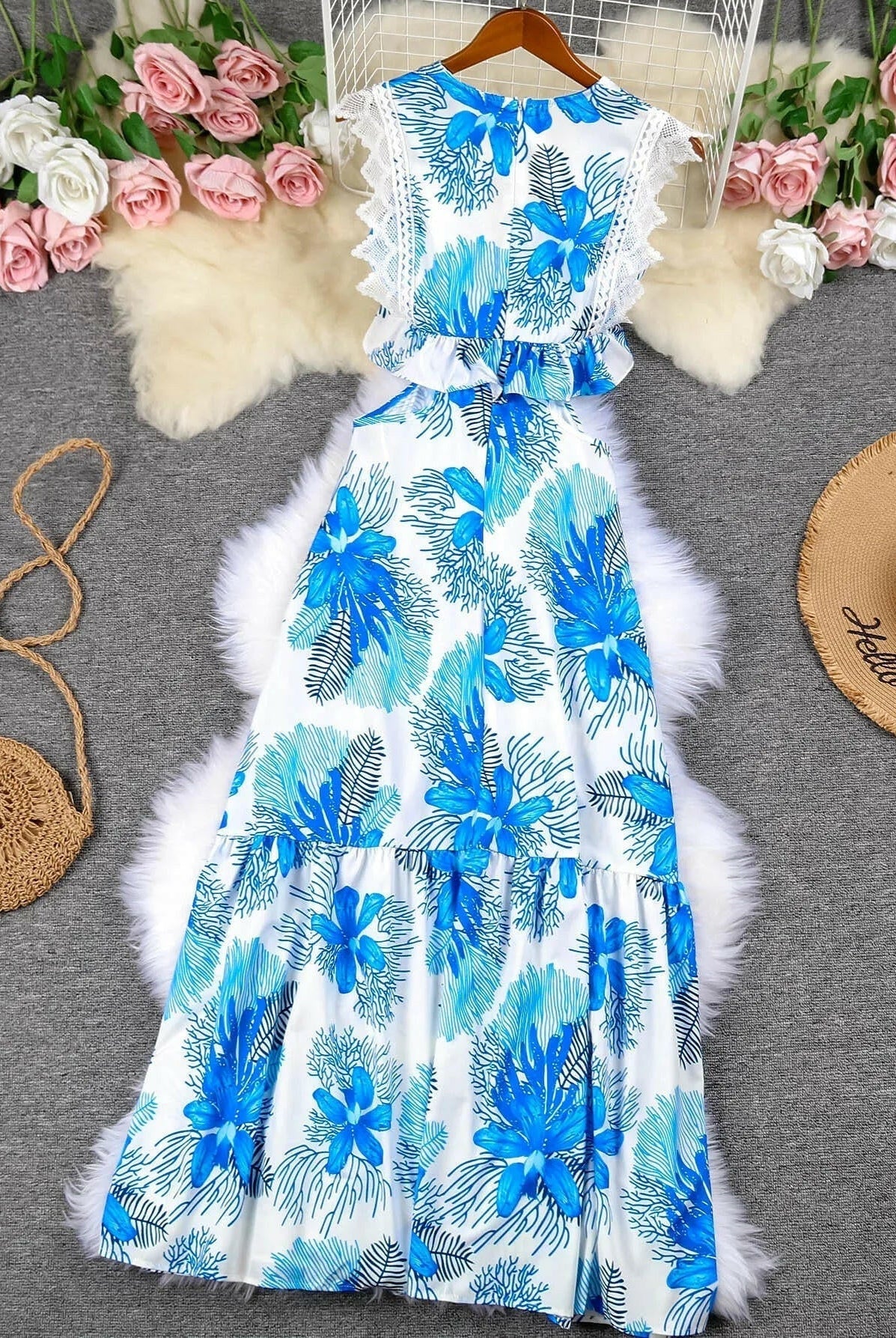 Blue sleeveless lace maxi dress by Lumina Wear, featuring a trendy design and flowing silhouette for elegant summer wear.
