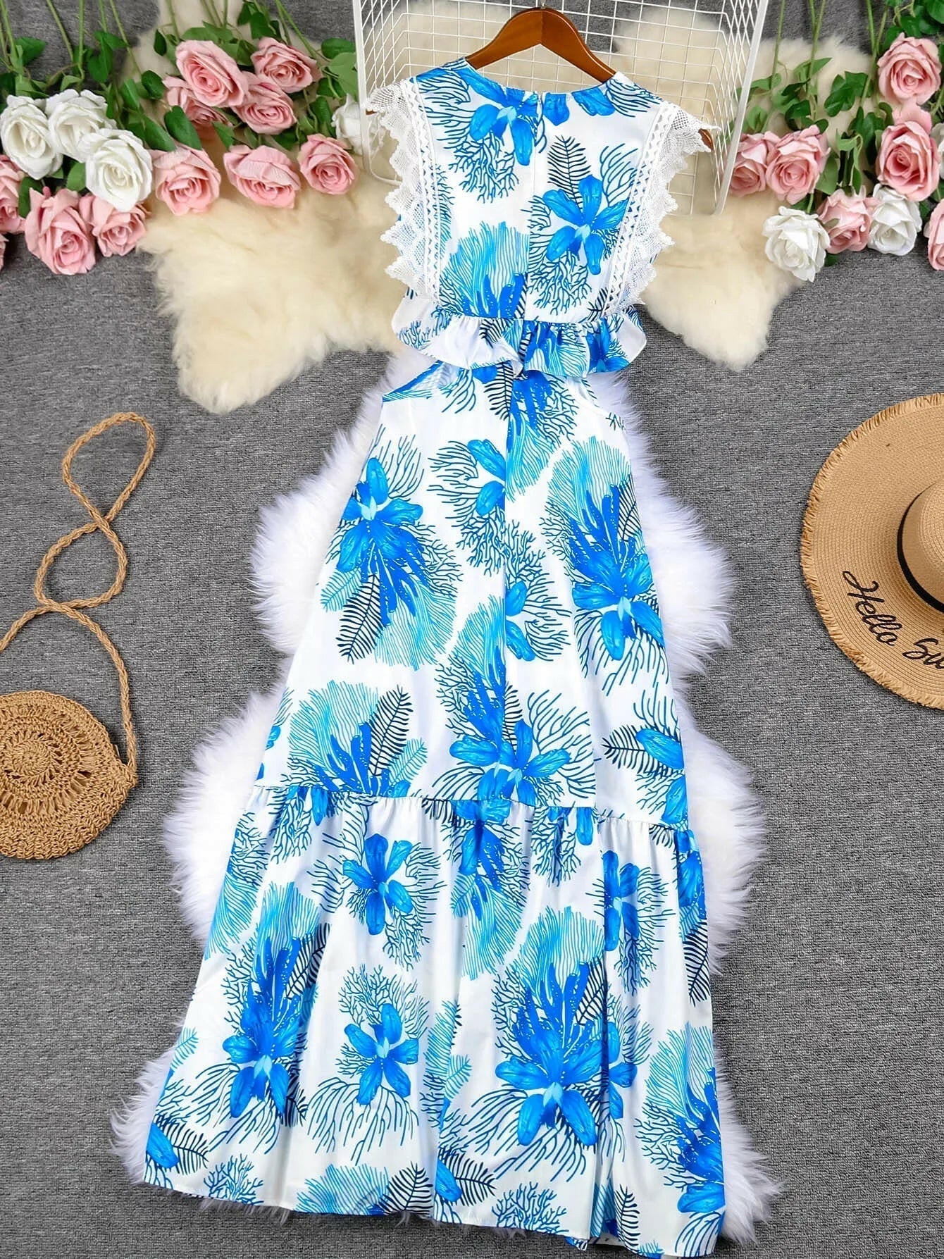 Blue sleeveless lace maxi dress by Lumina Vancouver, Margie style, featuring a trendy, elegant design perfect for summer occasions.