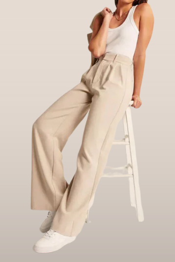 Cream high-waisted wide-leg trousers for women by Lumina Wear, showcasing a chic, relaxed fit and stylish silhouette.