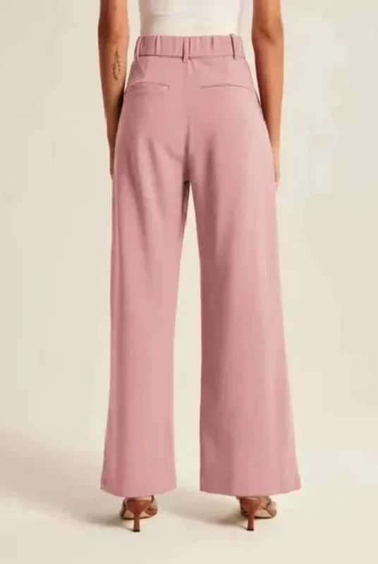 Cream high-waisted, wide-leg women's trousers by Lumina Wear, styled with a relaxed fit and tailored silhouette.