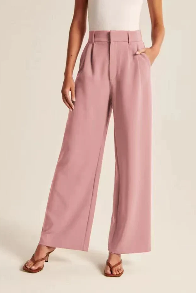 Cream high-waisted wide-leg women's trousers by Lumina Wear, styled with a relaxed fit and chic silhouette.