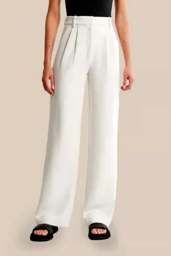 Cream high-waisted wide-leg women's trousers by Lumina Wear, styled with a relaxed fit and modern silhouette.