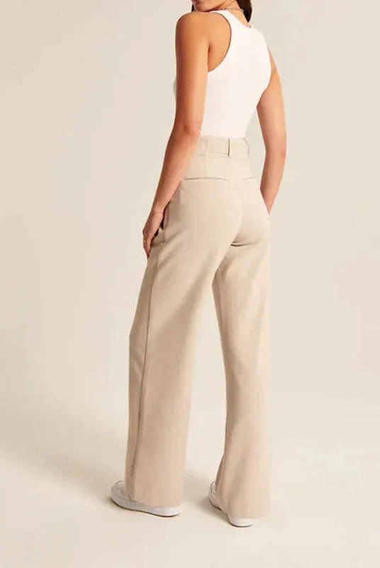 Cream high-waisted wide-leg trousers for women by Lumina Wear, featuring a chic, relaxed fit and elegant silhouette.