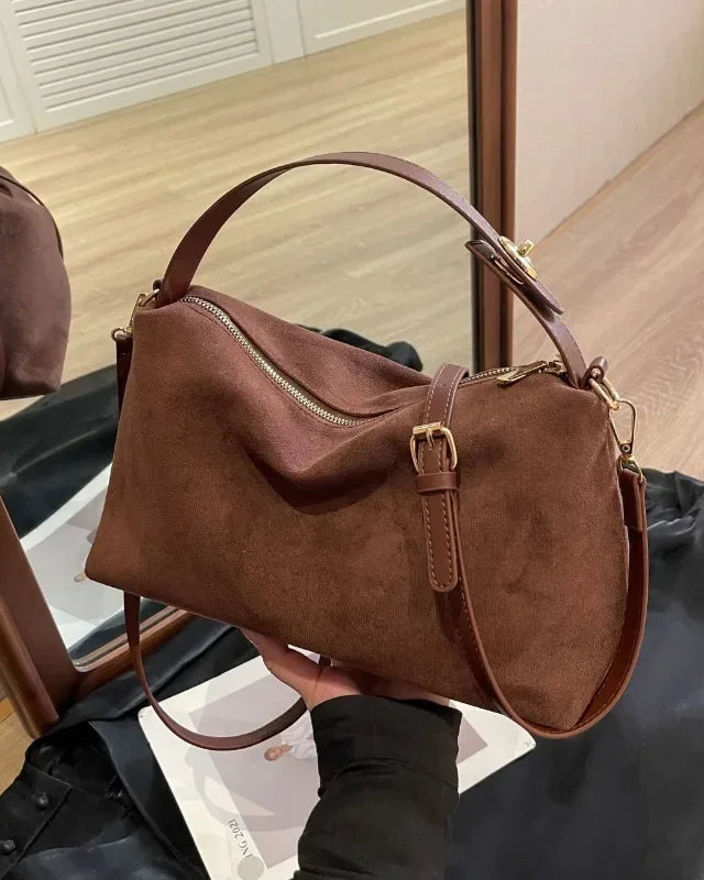 Textured minimalist Lumina Marielle shoulder handbag with curved shape in coffee color, stylish and modern accessory.