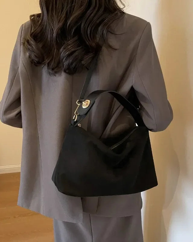 Marielle textured minimalist shoulder bag with curved shape by Lumina Wear, in coffee color, stylish and modern handbag.