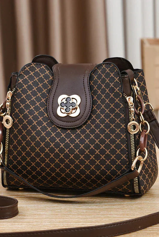 Black Marjorie quilted charm handbag by Lumina Wear with adjustable strap, stylish and elegant for everyday use.
