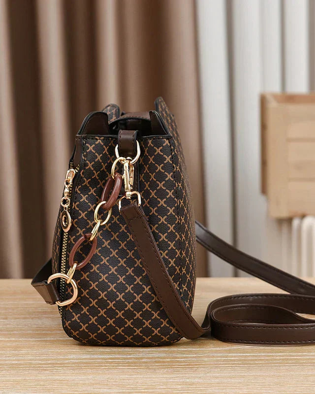 Black Lumina Wear Marjorie quilted handbag with adjustable strap, elegant charm bag for stylish everyday use.