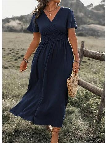 Green MARY™ elegant summer dress with V-neck by Lumina Vancouver, shown on a hanger, stylish and lightweight for warm weather.