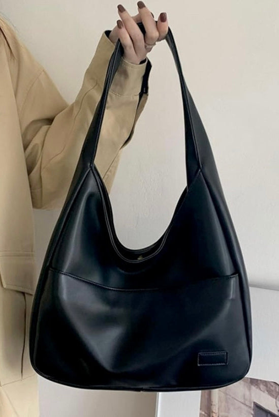 Black Maya Lumina Wear shoulder bag with spacious design and chic vegan leather, stylish and practical for everyday use.