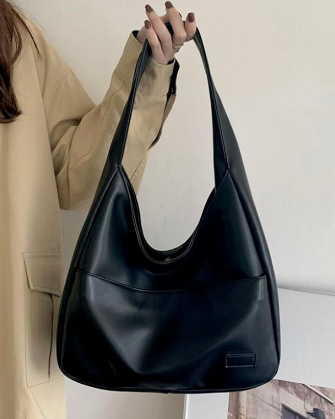 Black Lumina Wear Maya shoulder handbag with spacious design and chic vegan leather, stylish for daily use.