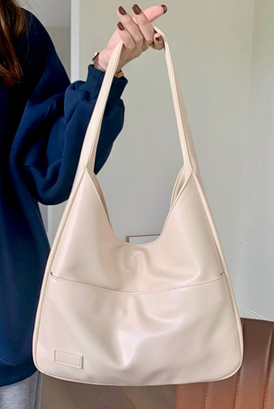 Black Maya Lumina Wear shoulder bag with spacious design and chic vegan leather, ideal for stylish everyday use.
