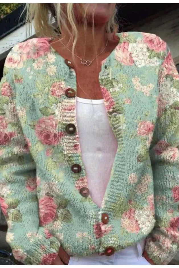 Lumina Wear Merryn elegant floral print cardigan displayed on a model, showcasing lightweight knit and vibrant flower pattern.