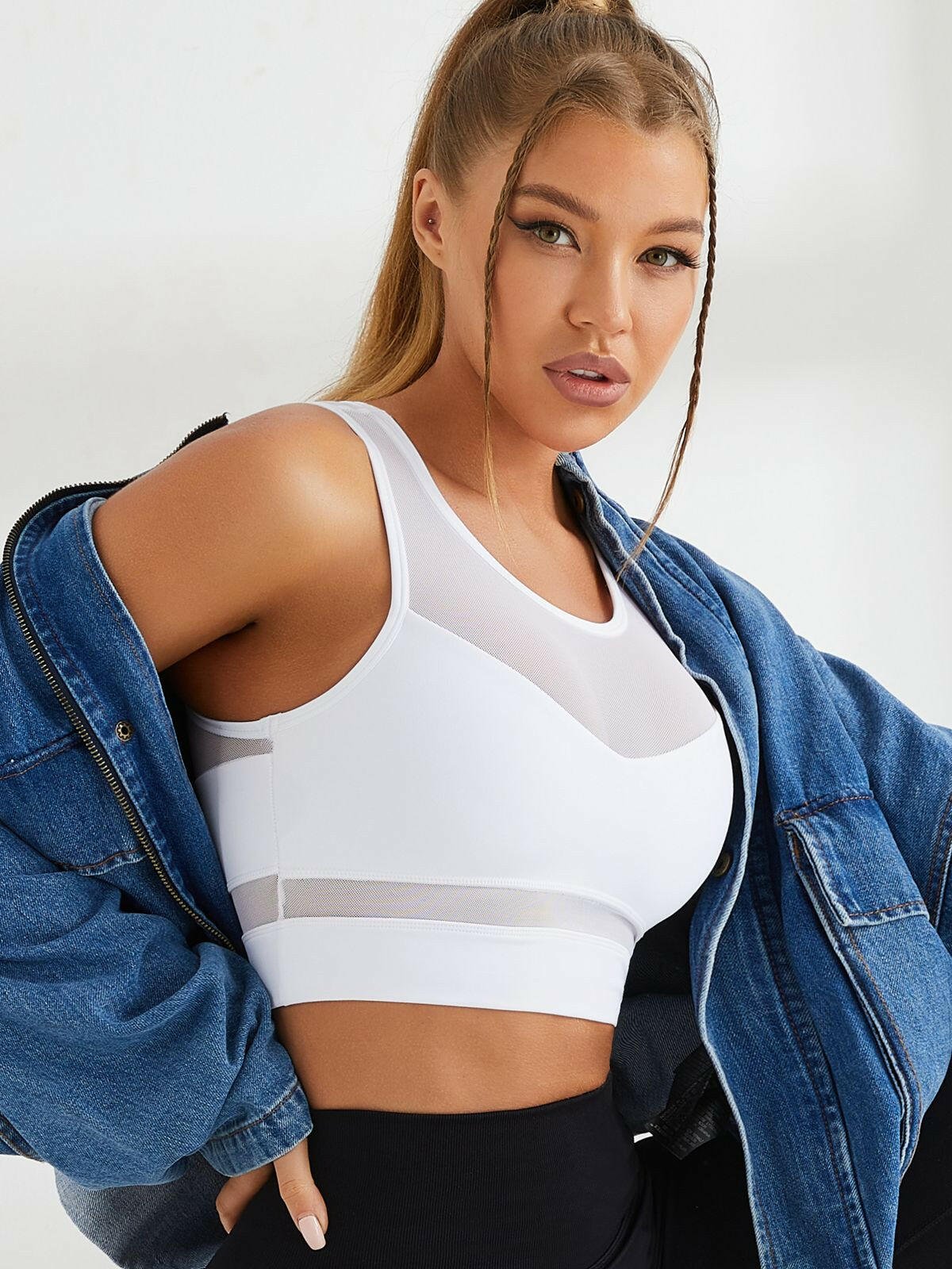 White Lumina Vancouver mesh shockproof sports bra with supportive design and breathable fabric for active wear.