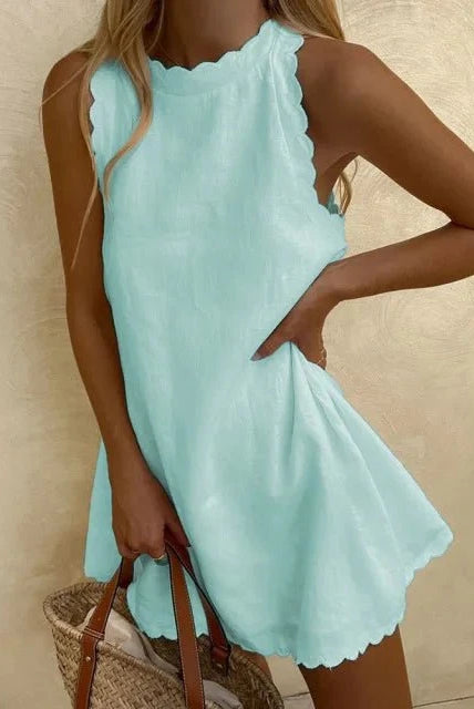 Light blue Lumina Wear Miami casual elegant dress displayed on a hanger, showcasing its stylish design and flowing fabric.