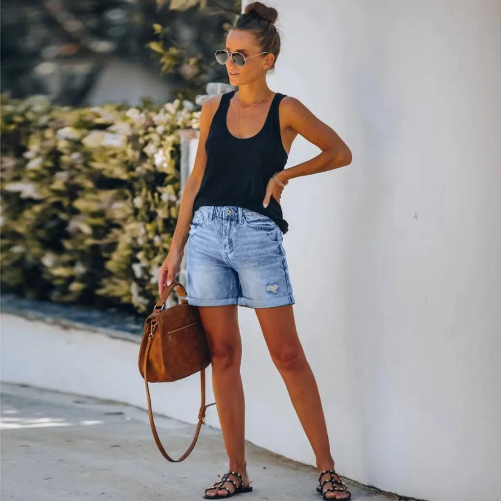 Light blue Mila high-waisted denim shorts with rolled hem from Lumina Wear, showcasing a trendy casual style.