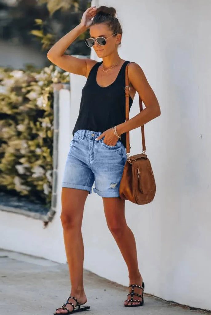 Light blue high-waisted denim shorts with rolled hem from Lumina Wear, styled with casual fit and trendy design.