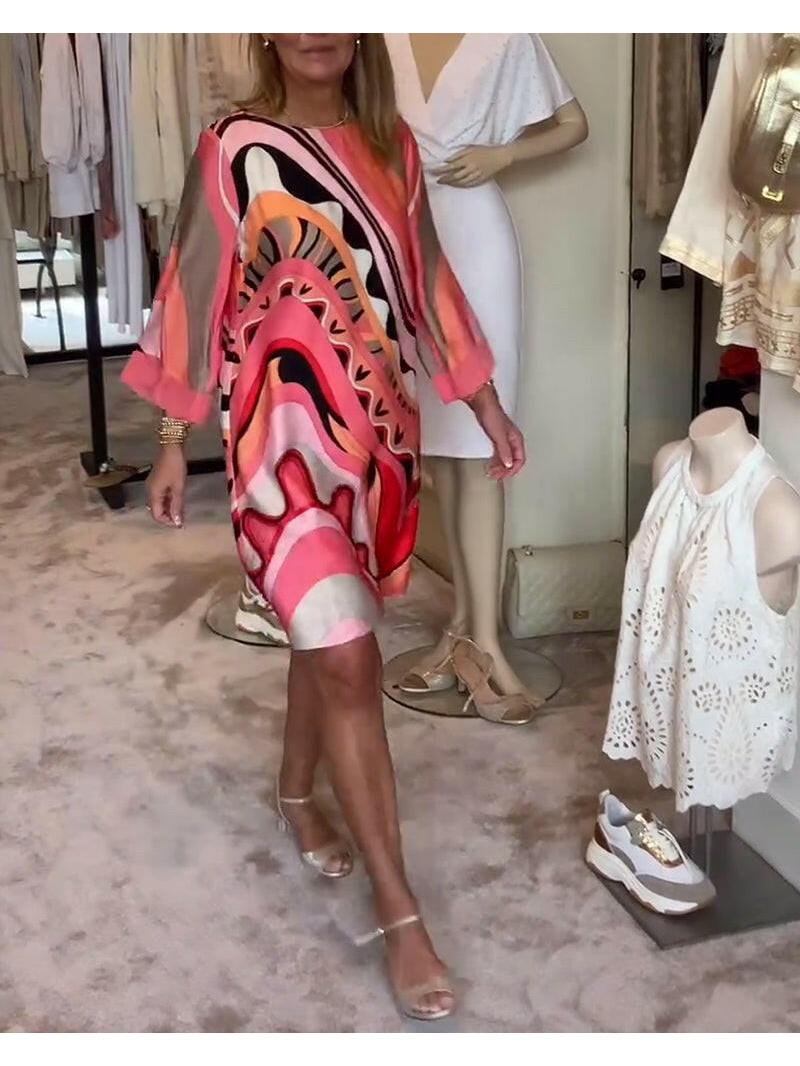 Mirabella™ vibrant abstract print dress in coral pink by Lumina Vancouver, featuring a stylish, colorful design for casual wear.