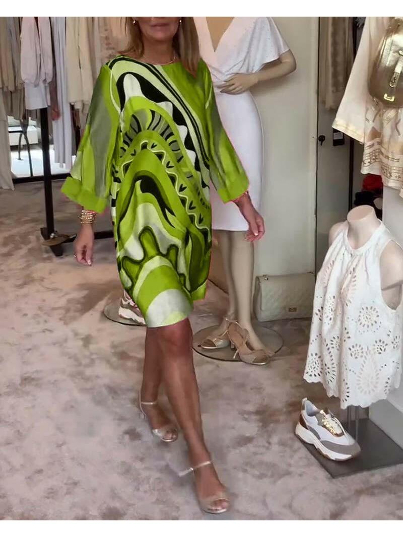 Mirabella™ vibrant abstract print coral pink dress by Lumina Vancouver, showcasing a stylish, colorful design on lightweight fabric.