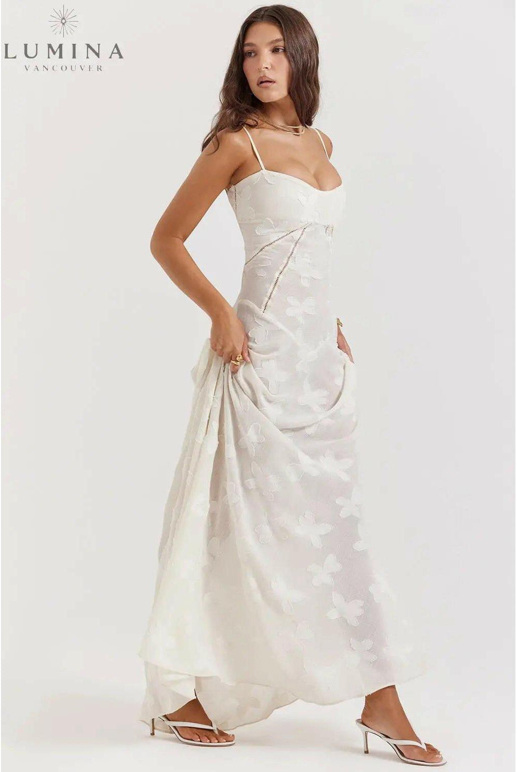 White Mireille Romantic Summer Dress by Lumina Wear, featuring lightweight fabric and elegant design, perfect for holiday vibes.