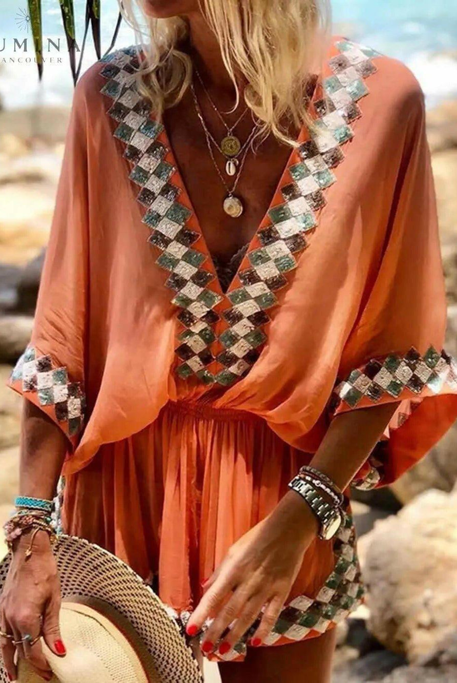 Orange loose beach long sleeve romper from Lumina Vancouver's Miriam summer dress collection, perfect for warm-weather wear.