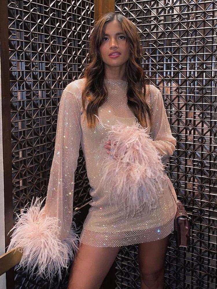 Black sequin mini dress by Lumina Vancouver, featuring a fitted silhouette and shimmering embellishments for a glamorous look.