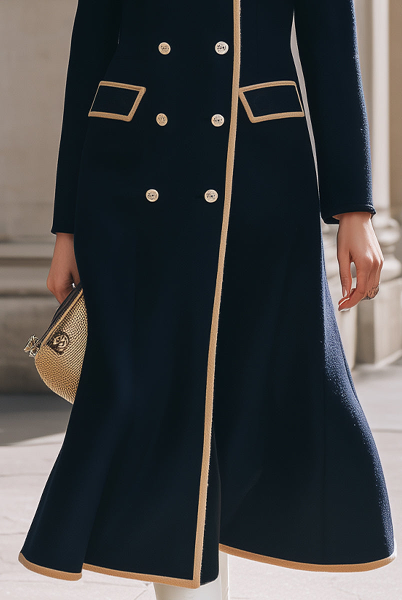 Navy blue Nadia double-breasted coat with camel contrast details from Lumina Vancouver, featuring a stylish, tailored design.