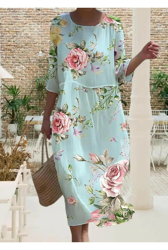 Blue Naia floral dress by Lumina Wear featuring elegant, stylish design, perfect for sophisticated occasions.