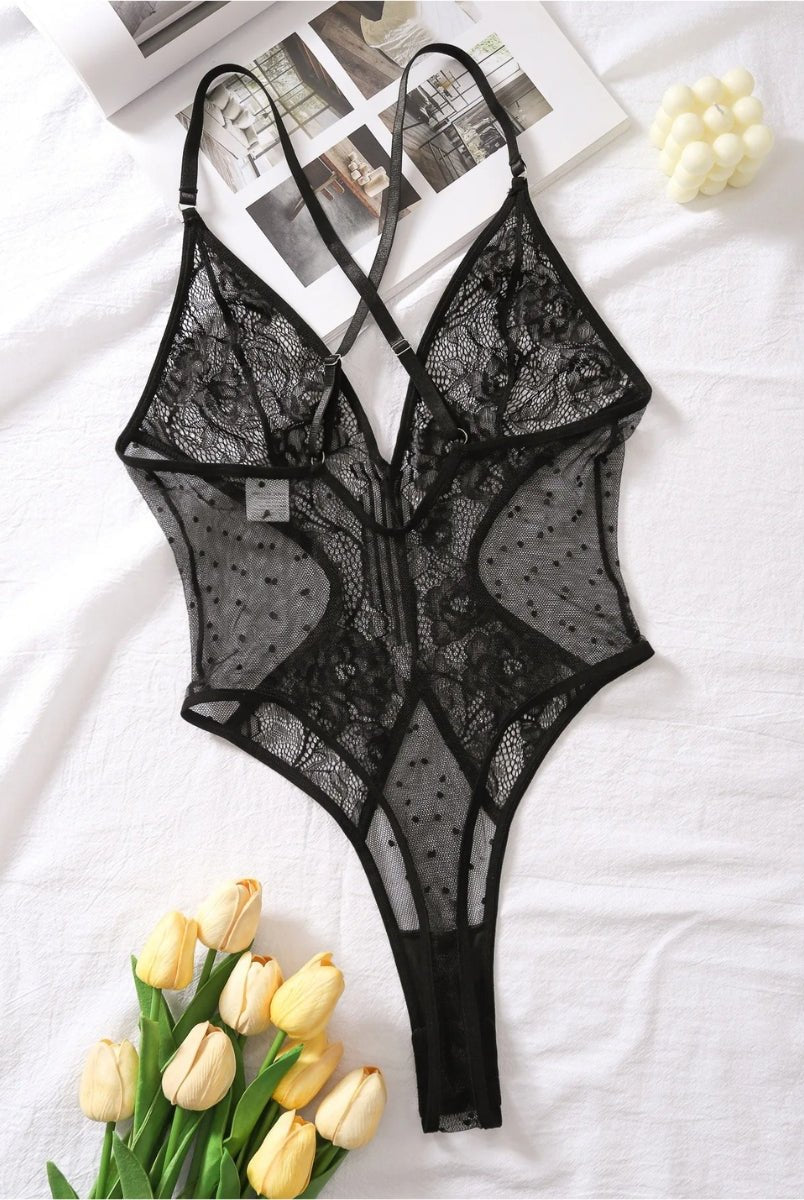 Naomi Lumina Wear Josette Bodysuit in size S, shown on a model, featuring a sleek, fitted design with a high neckline.