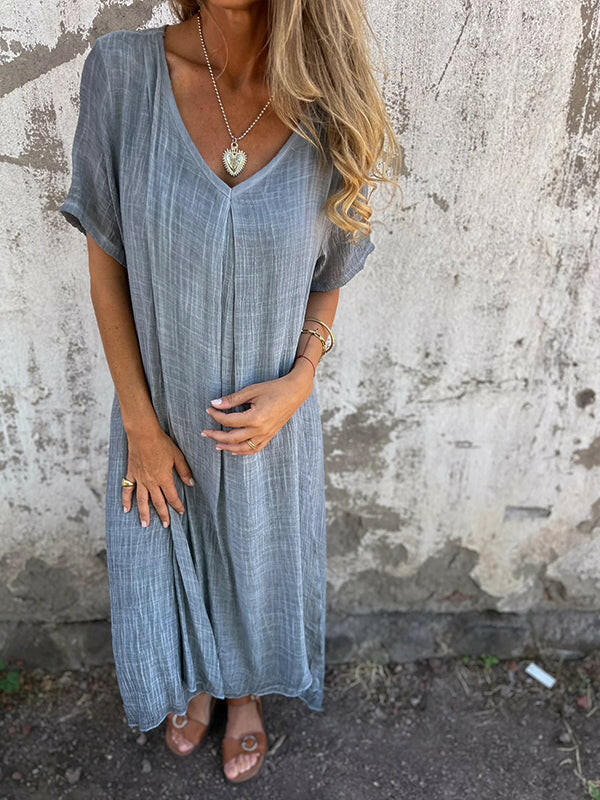 Blue NIA™ maxi dress by Lumina Vancouver, flowing fabric and elegant design, perfect for summer or special occasions.
