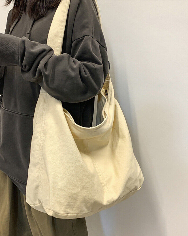 Beige minimalist canvas shoulder bag with oversized design by Lumina Wear, featuring a stylish and spacious hand-held look.