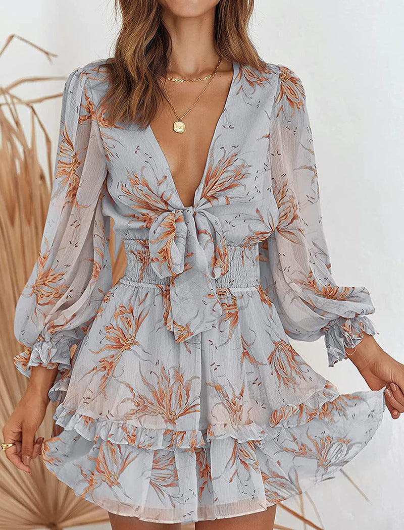 Deirdre Bella floral V-neck tie mini dress by Lumina Vancouver, pink with a fitted waist and floral pattern, perfect for summer.