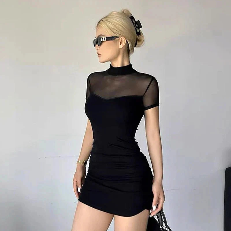 Black Berit Belle bodycon mini dress by Lumina Vancouver, fitted silhouette, sleeveless design, and V-neck neckline.