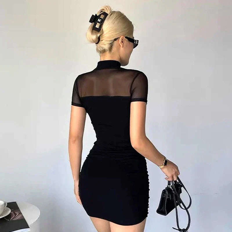 Black Berit Belle bodycon mini dress by Lumina Vancouver, fitted design with sleek fabric, shown on a mannequin.