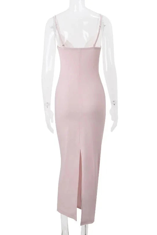 Pink Rosamond maxi bodycon dress with corset bodice by Lumina Wear, shown on a model, highlighting its fitted silhouette and elegant design.